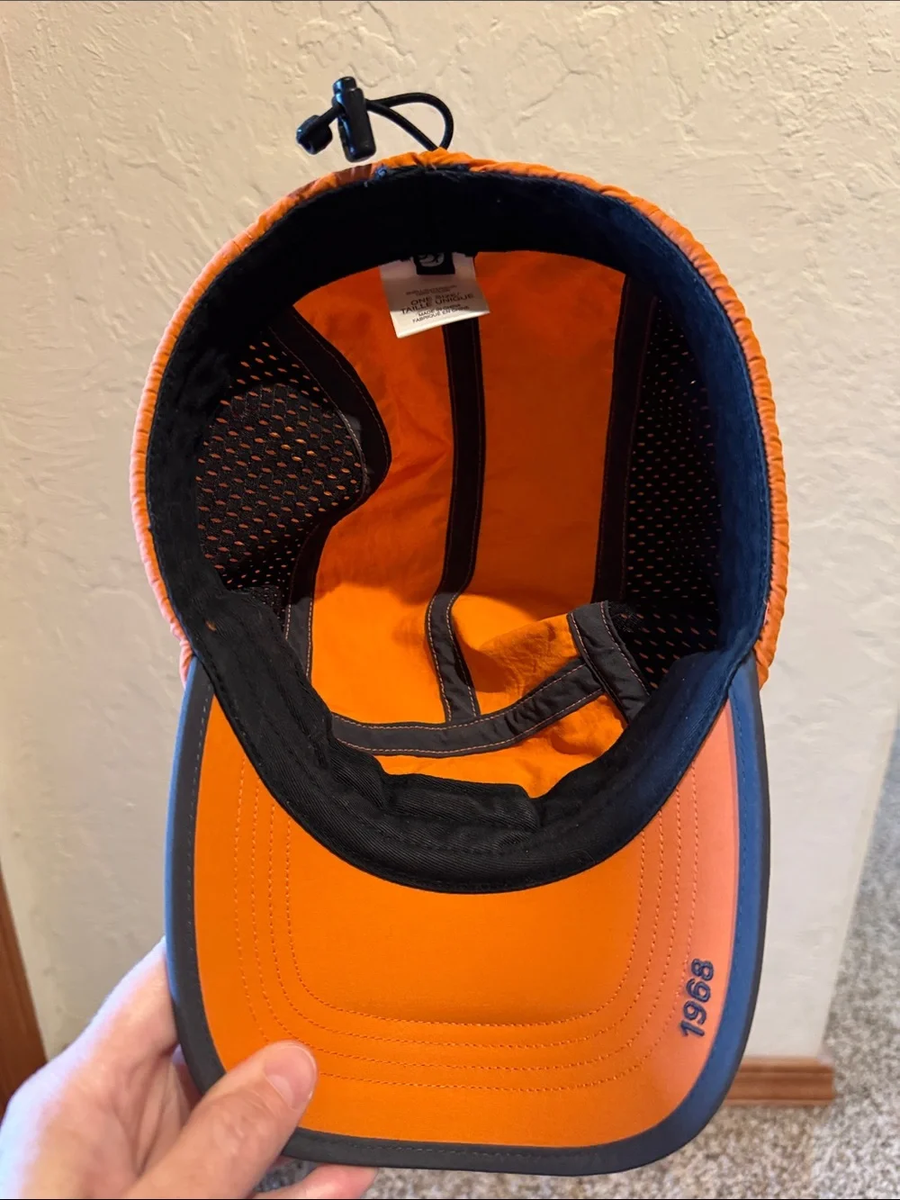 The North Face Orange Men's Trail Hat with Black Logo